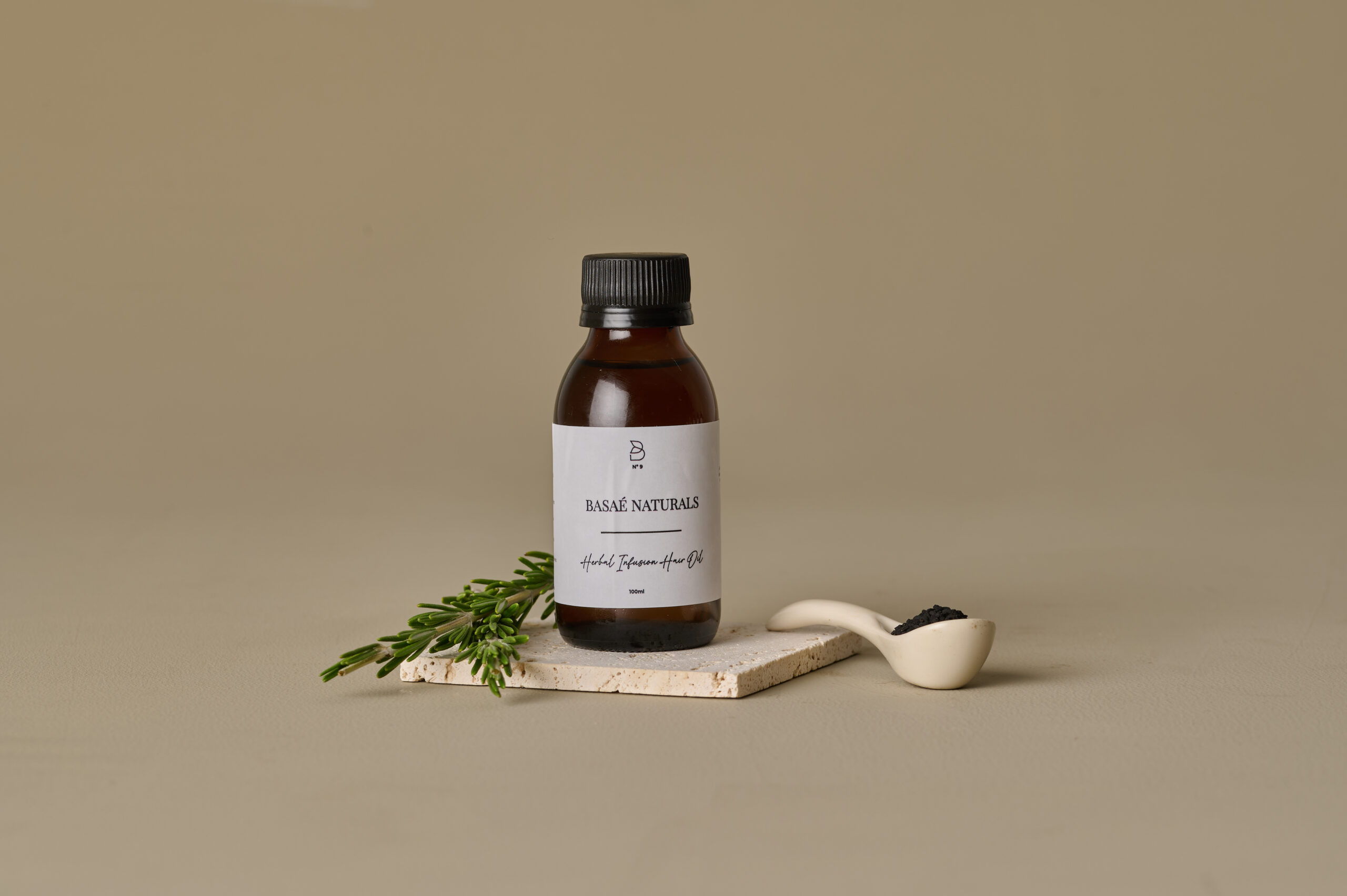 Basaè Naturals Herbal Infusion Hair Oil in amber glass bottle